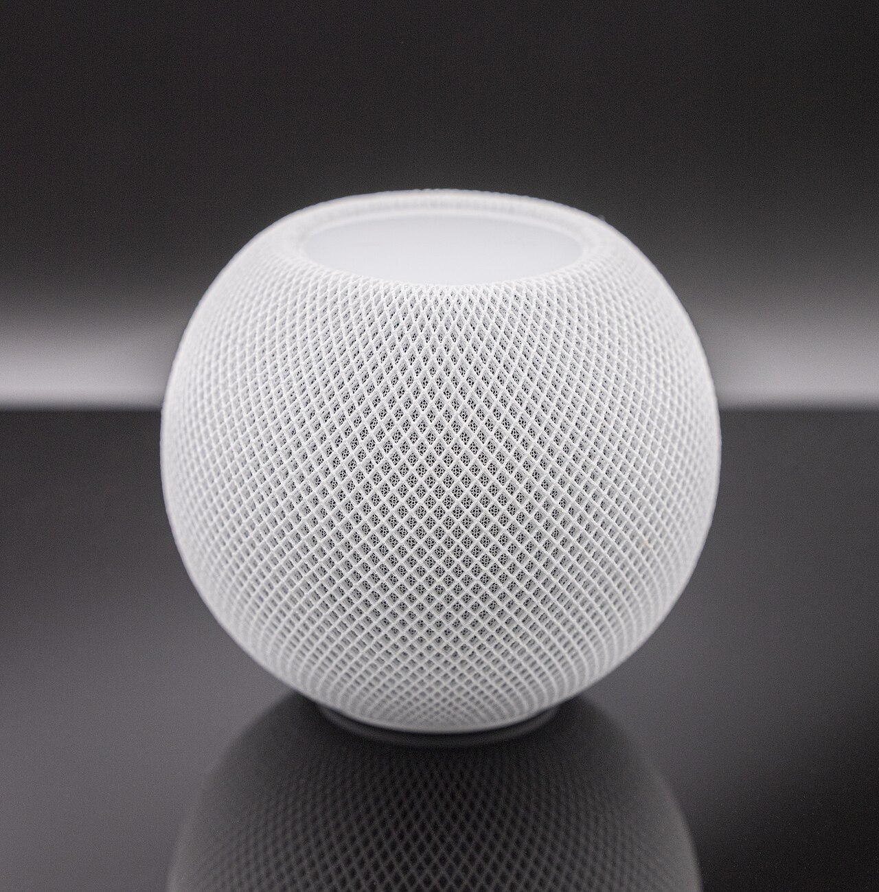 Fotografía técnica oficial de Apple HomePod mini Altavoz Inteligente con Siri y Router de Borde Thread - Vista frontal con fondo neutro
